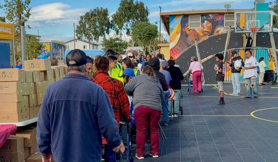 Neighbors in line at a community food distribution